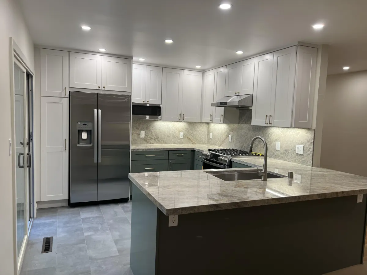 Renovated kitchen project showing cabinets in white and graphite