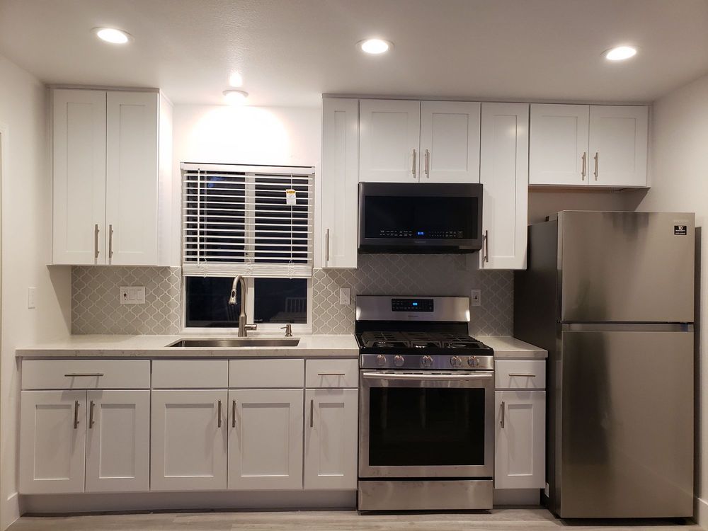 White kitchen remodel project with appliances