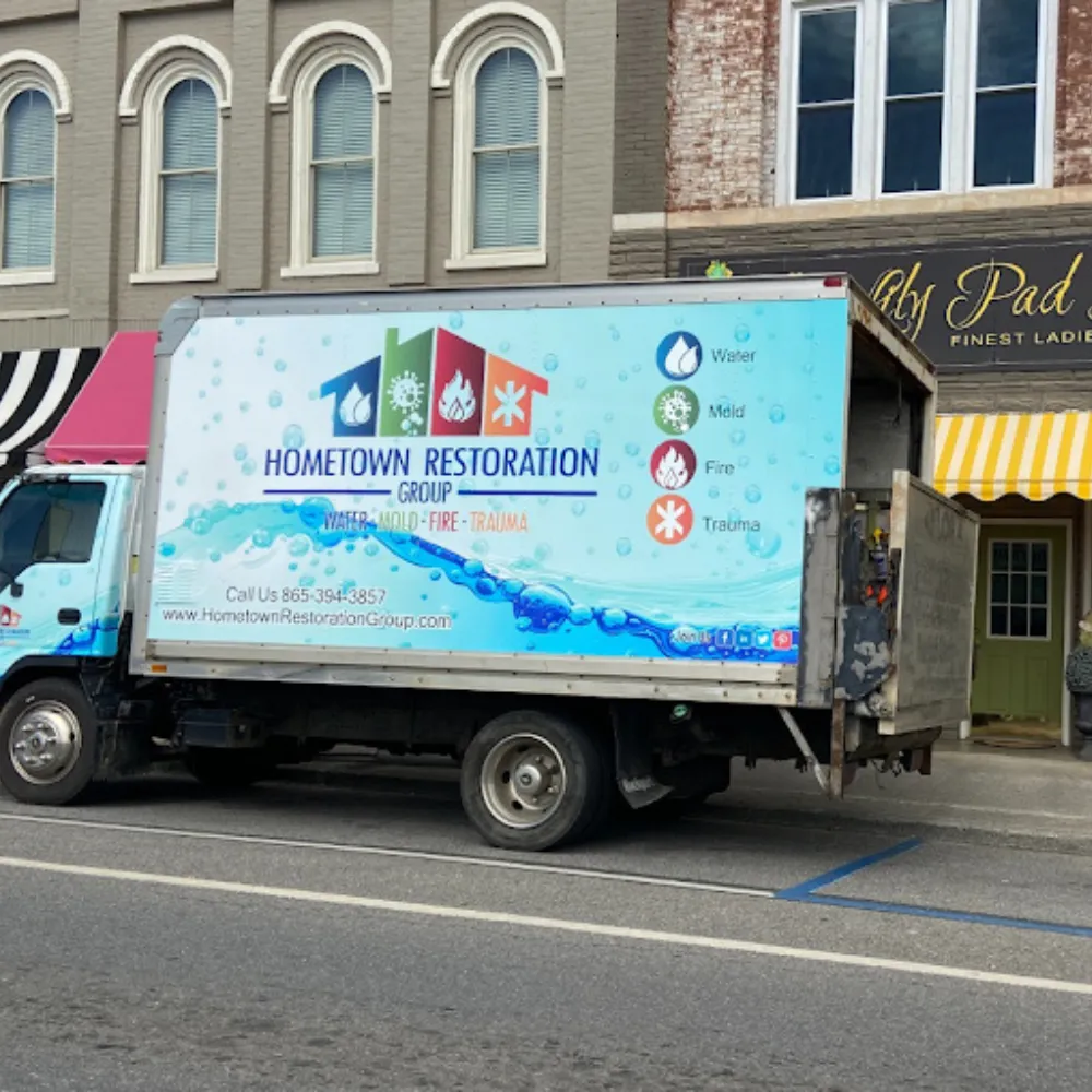 hometown restoration group truck on a knoxville street between jobs