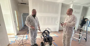 local restoration crew arriving at a knoxville home with service van parked in the driveway