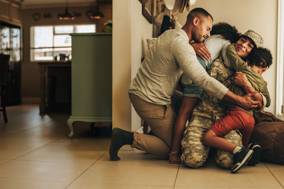 Family celebrating moving into their new home purchased with a VA loan in Fort Bend County
