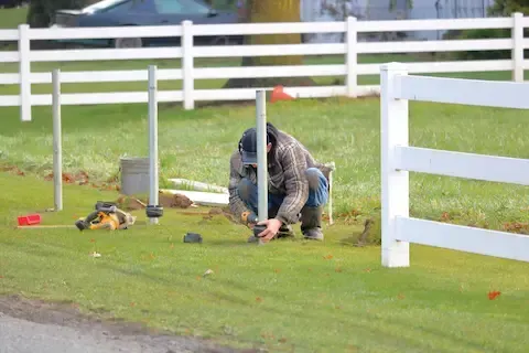 Residential vinyl fence installation in progress by Brownsville Fence Contractors