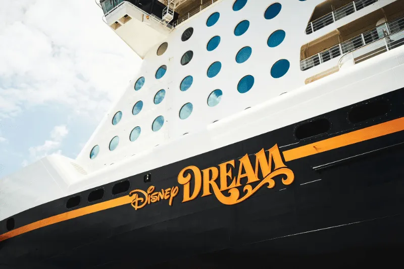 Disney Cruise Line at sea with the ship and the sunset