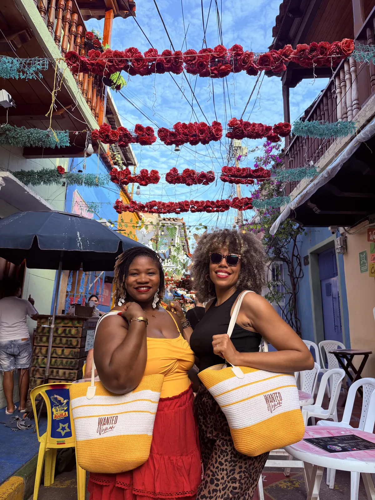 Women enjoying colorful streets of Cartagena during the WANTED Woman Escape
