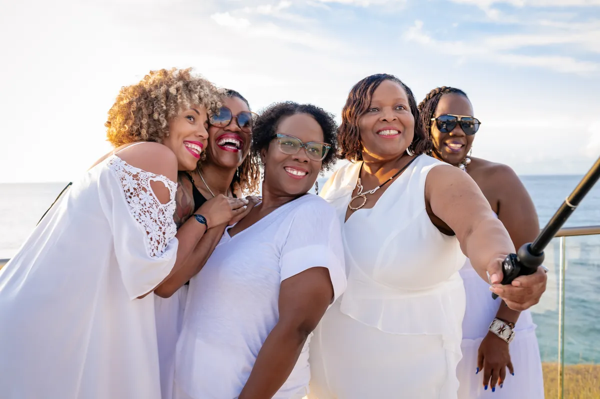 Women taking a selfie together during the WANTED Woman Escape in Grenada Caribbean