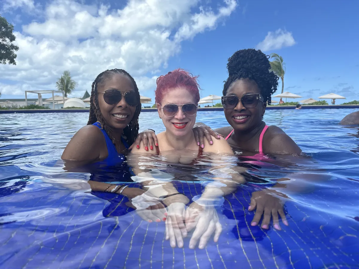 Women enjoying poolside moments during the WANTED Woman Escape in Antigua