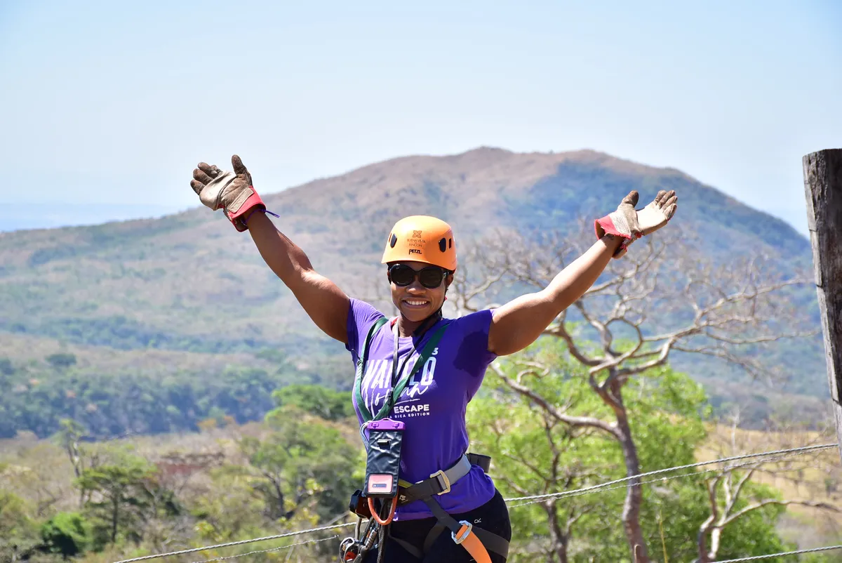 Woman ziplining during the WANTED Woman Escape adventure in Costa Rica
