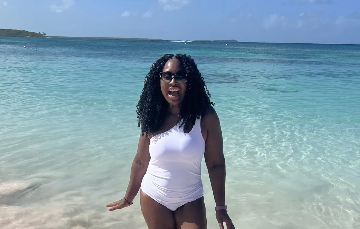 Woman enjoying the beach during the WANTED Woman Escape in Antigua Caribbean