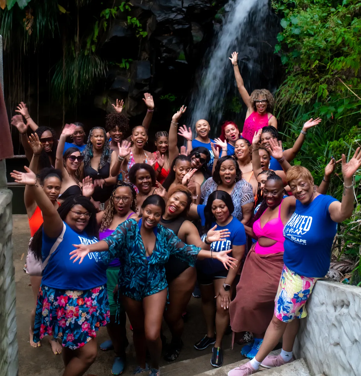 Women visiting a waterfall during the WANTED Woman Escape in Grenada