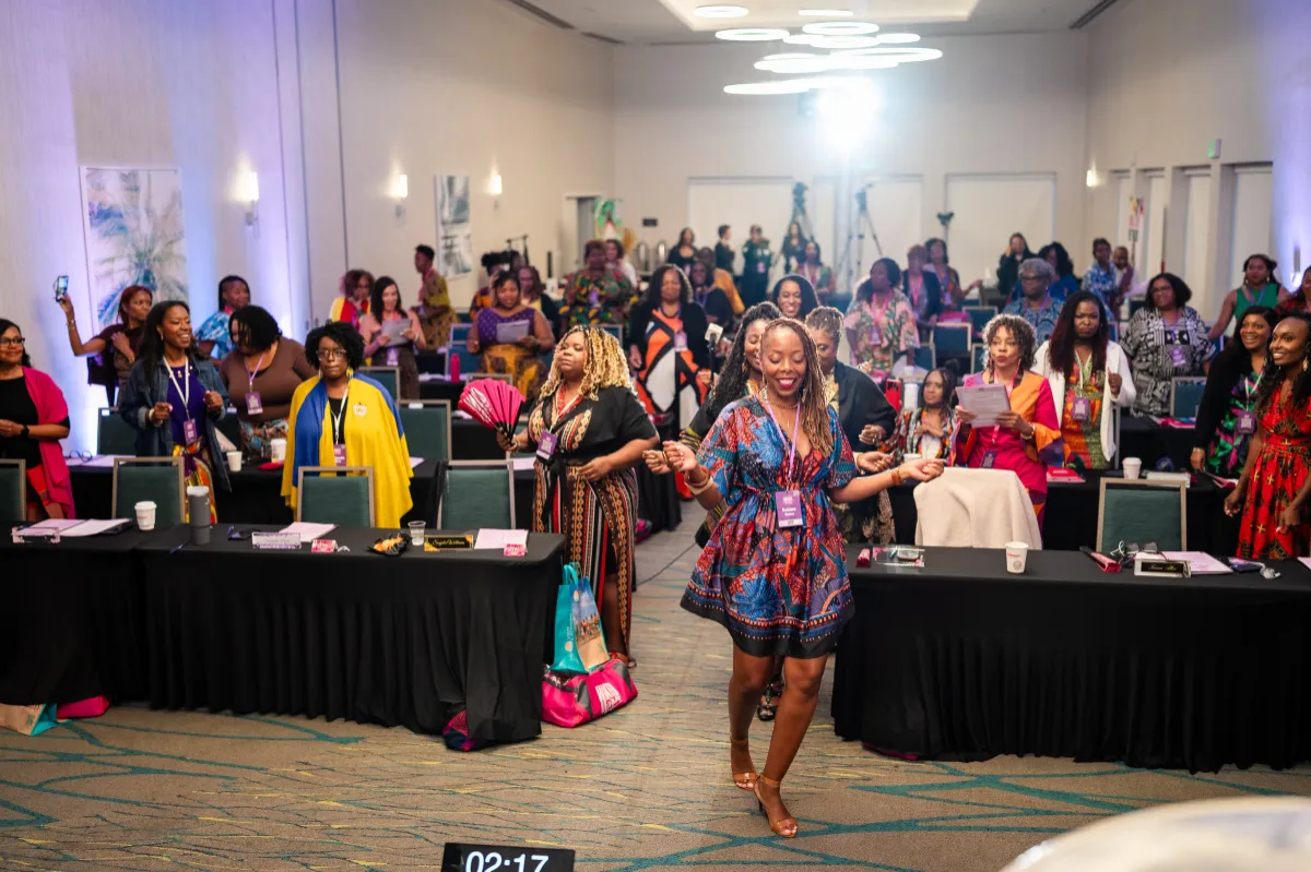 woman walking confidently at WANTED Woman Live event