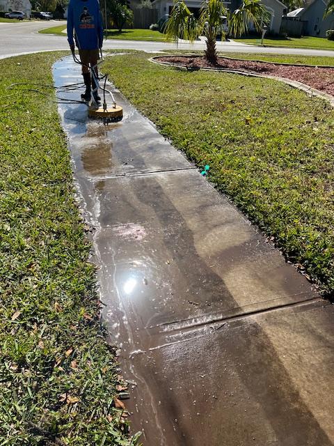 Pressure washing driveway in Melbourne, Florida