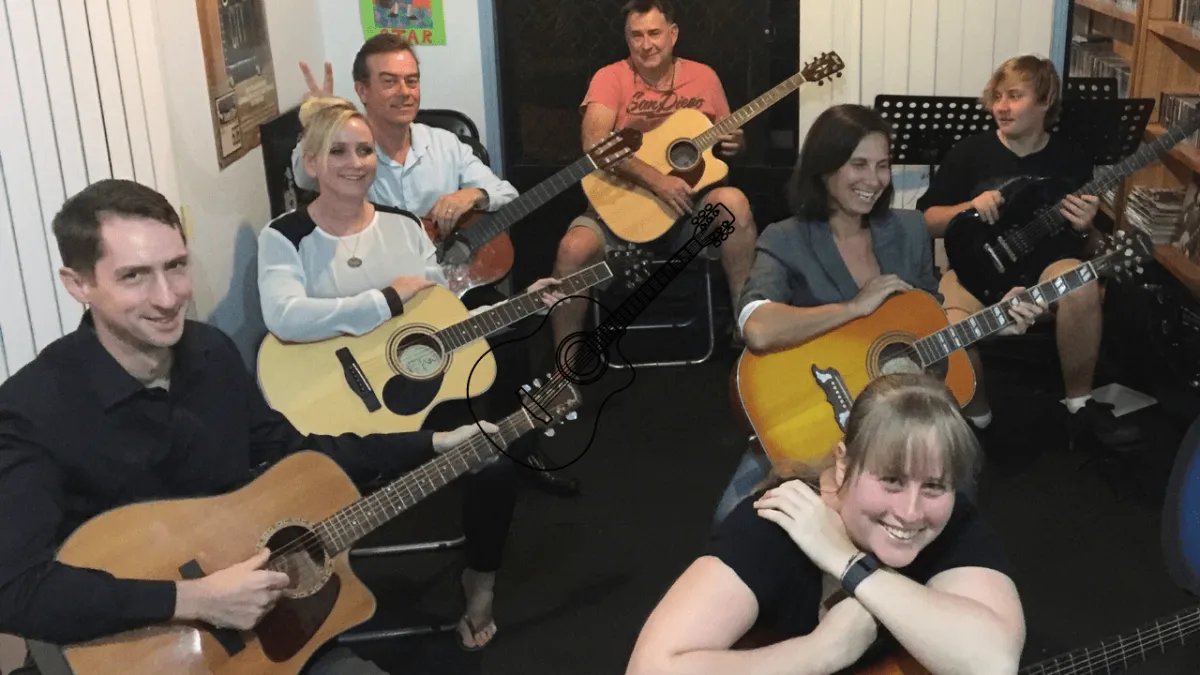 People having fun learning how to play guitar at guitar lessons near me Gold Coast