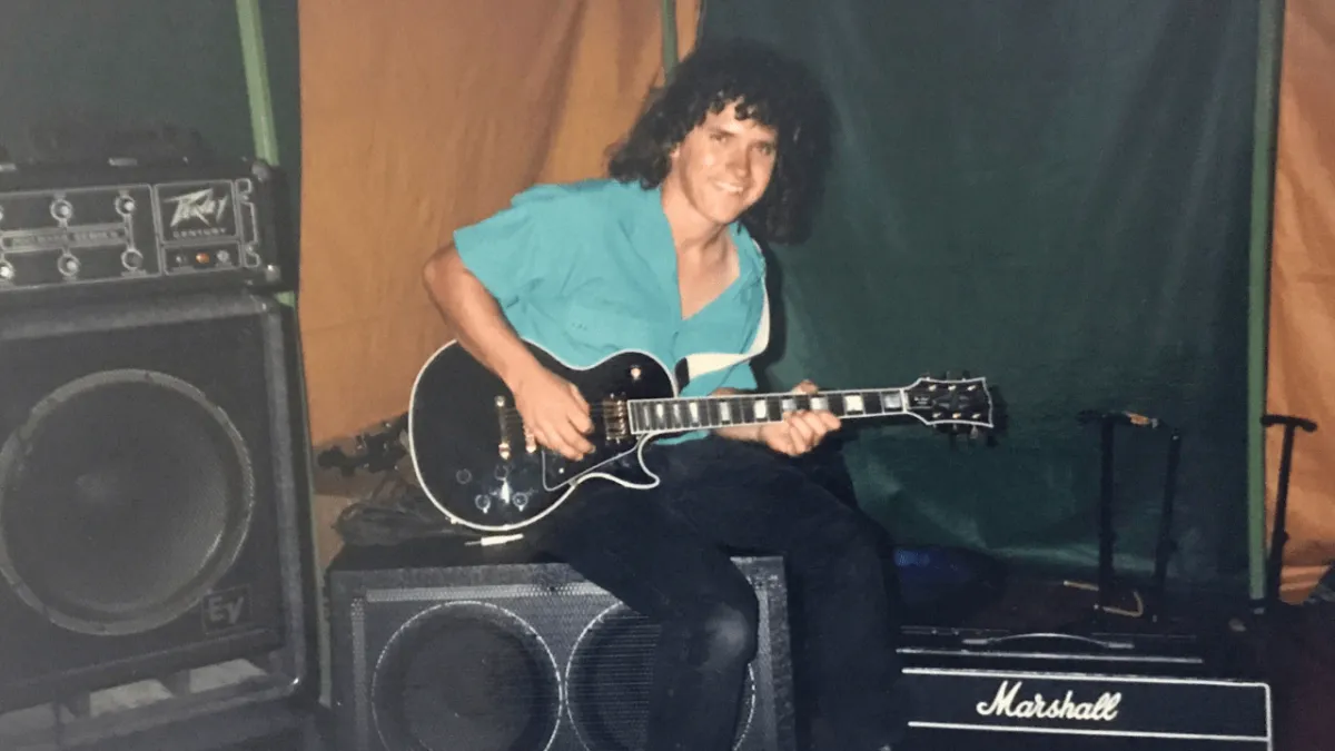 Allen Hopgood with his prized Les Paul guitar at Gold Coast School of Guitar in Carrara, Queensland