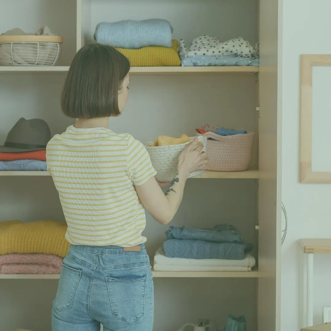 Professional Home Organizer organizing using open  shelves and bins for ADHD clients