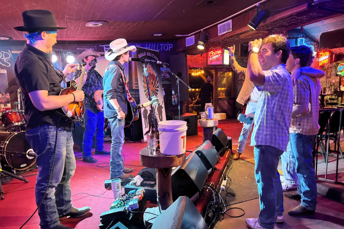 Bar crowd enjoying live country rock music