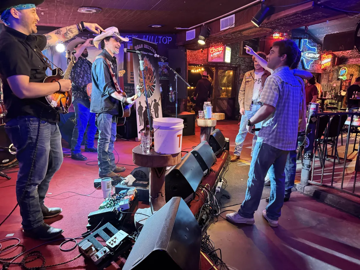 Dean Seltzer & The Redneck Mothers performing live for a packed crowd"