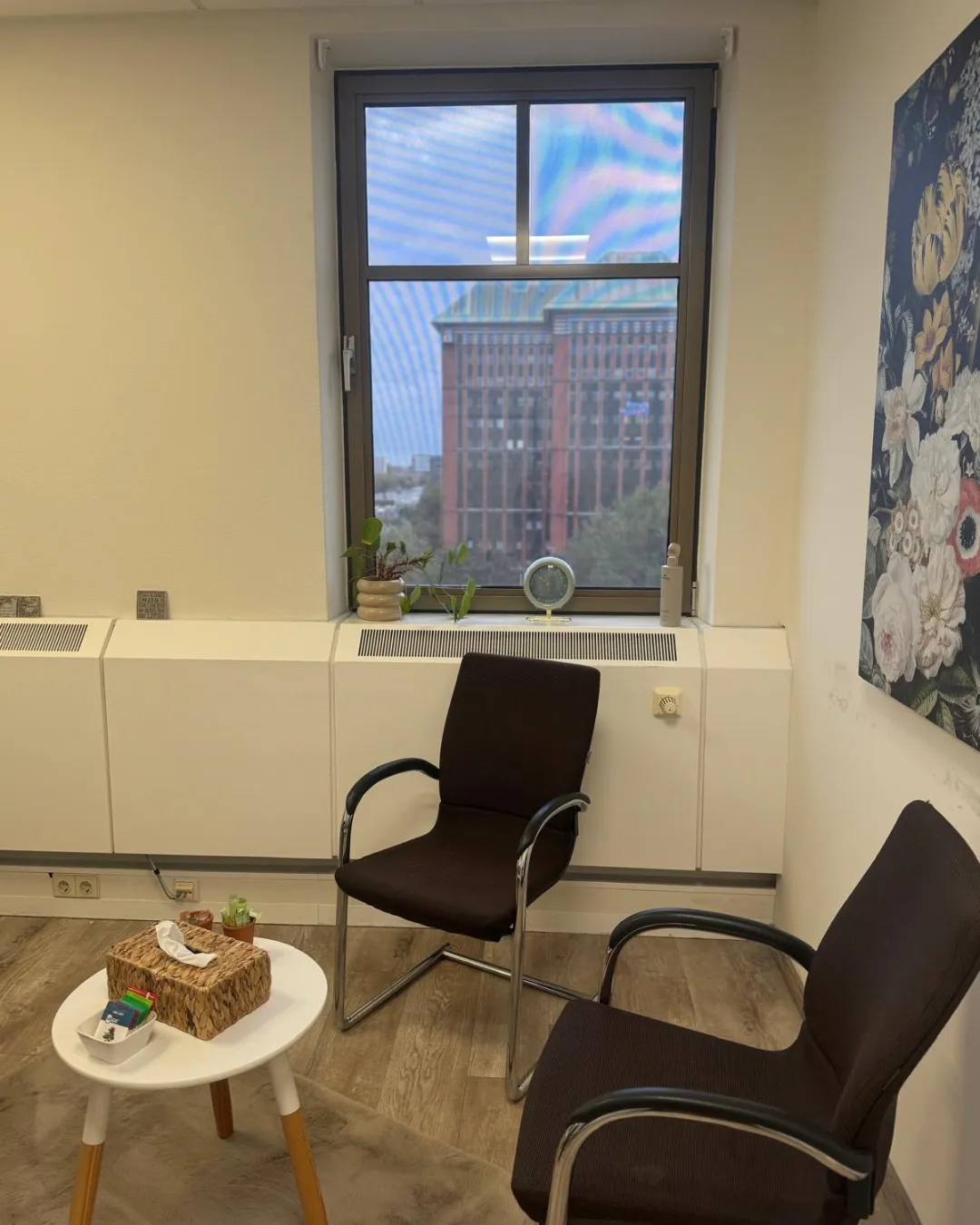 A flat lay of printed guides, a journal, and a pen on a soft beige table, with a pastel pink mug and a sprig of lavender, feminine and inviting.