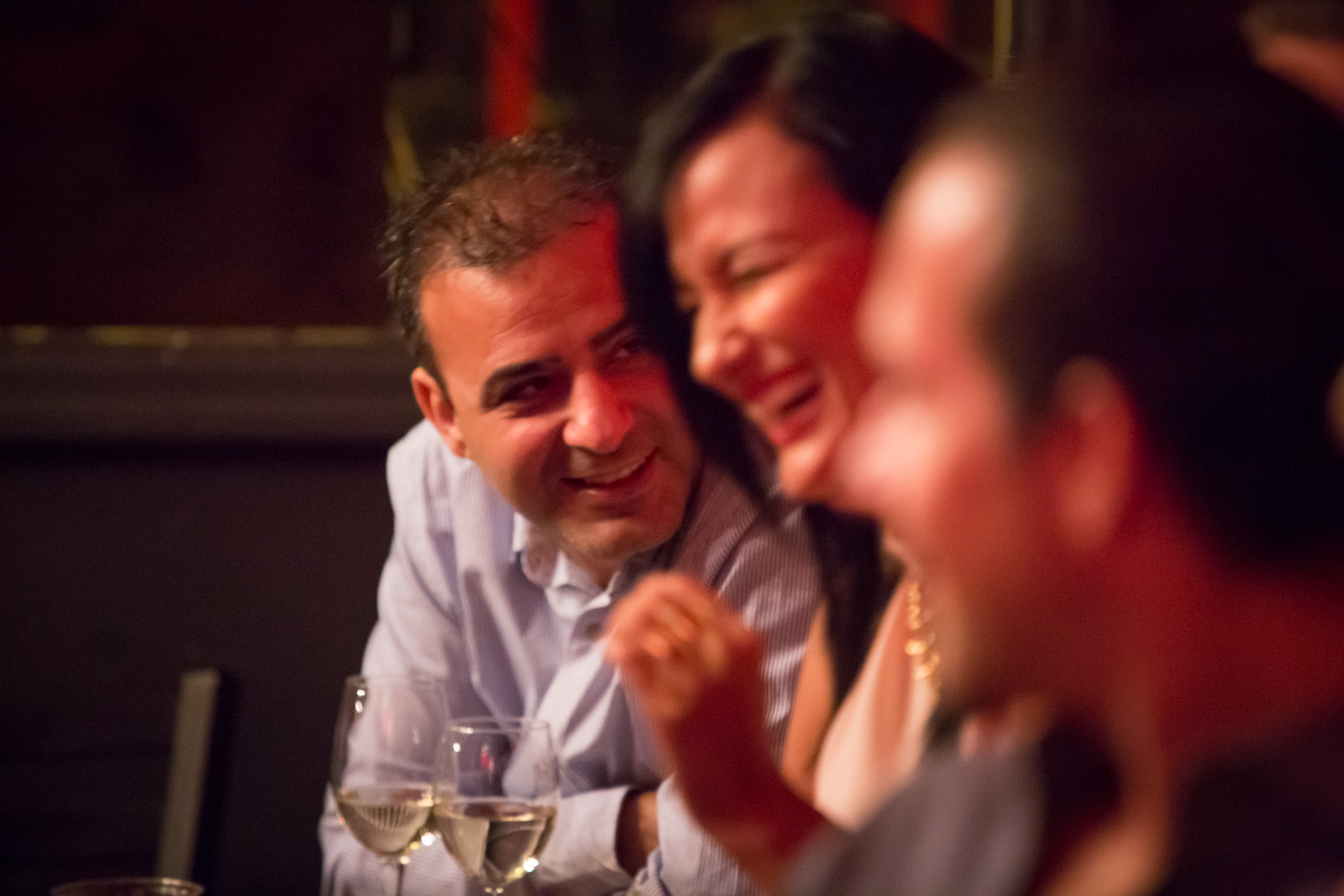 Elegant magic show in Miami with candlelit tables and magician on stage