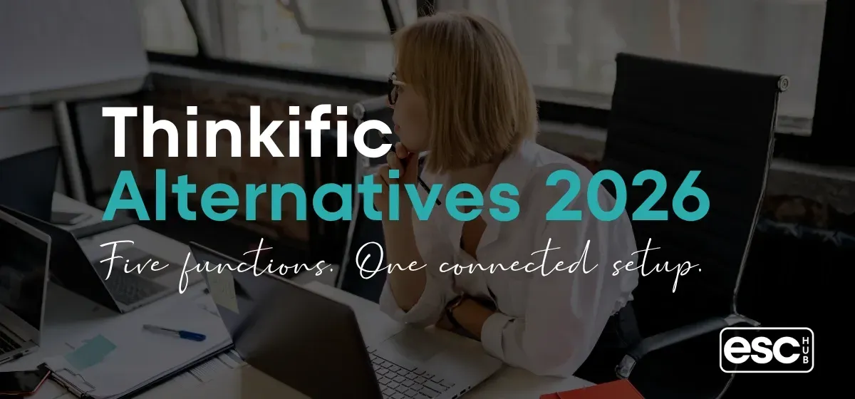 Woman at minimal desk with laptop and bright window - Thinkific alternatives for coaches and solopreneurs