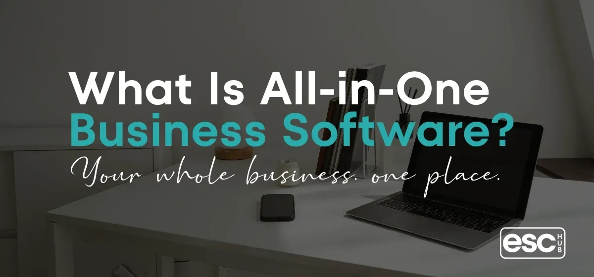 Woman working on laptop in bright minimal workspace representing all-in-one business software for solopreneurs