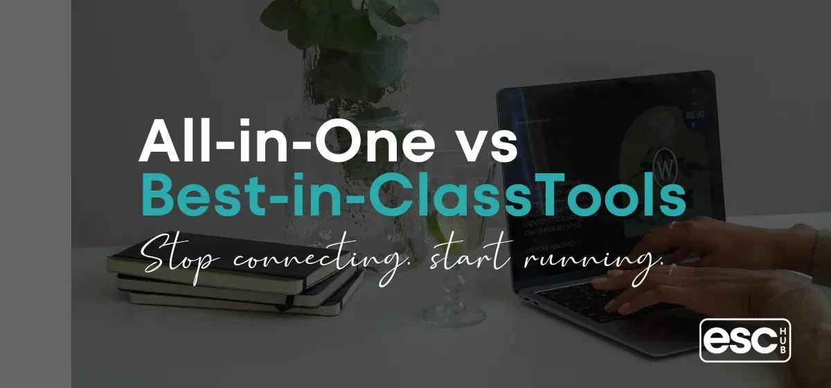 Clean minimal desk representing the choice between all-in-one and best-in-class business software for solopreneurs
