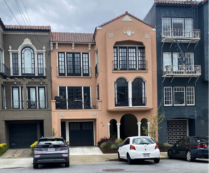 Wide-angle street view of a Petaluma neighborhood and a Progressive Plastering service van parked outside a home, clear midday light, photorealistic image showing local presence and accessibility.