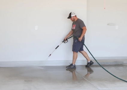 a man polishing the concrete floors