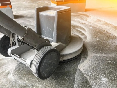 a person polishing a warehouse floor