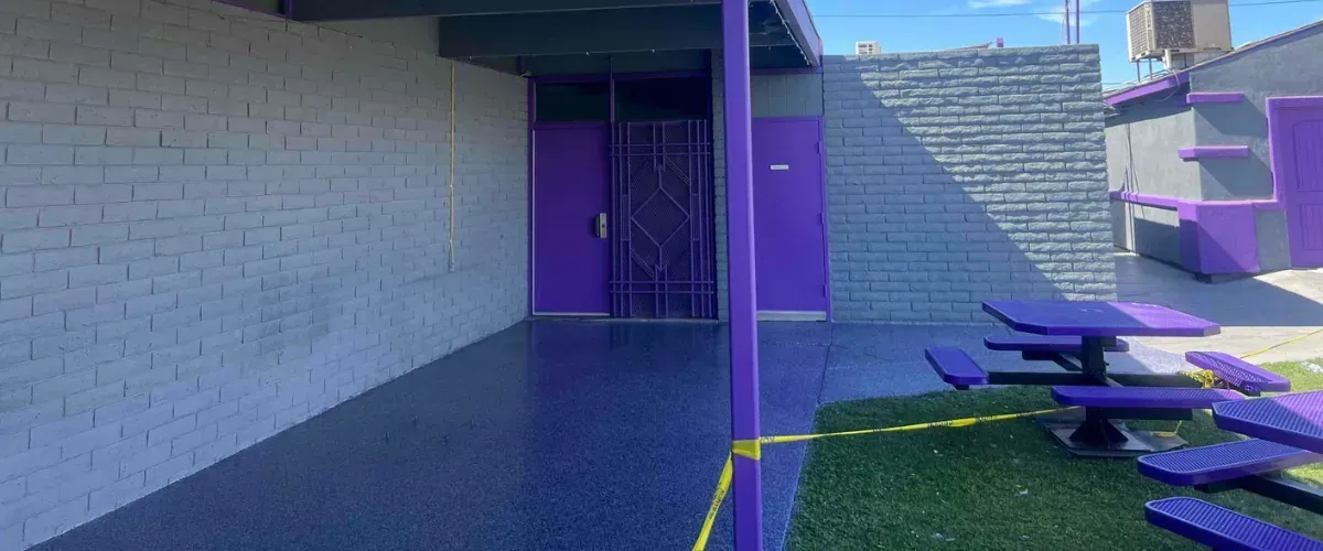 Commercial epoxy floor coating installed on outdoor patio area with textured finish and clean edges.