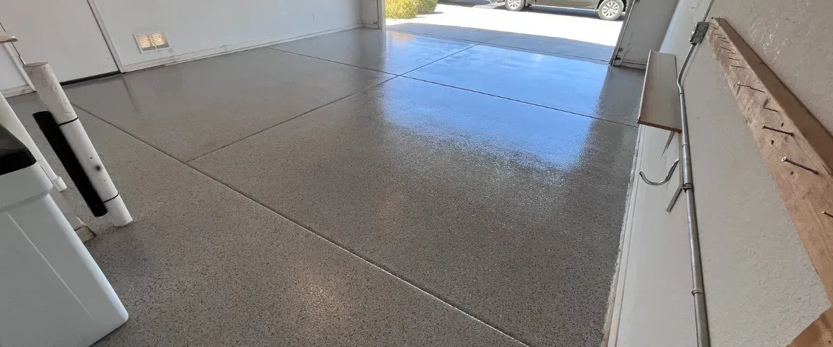Garage with glossy natural gray epoxy floor finish
