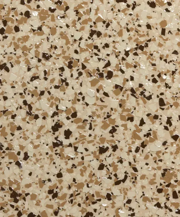 Close-up of tan and brown decorative chip epoxy garage floor finish