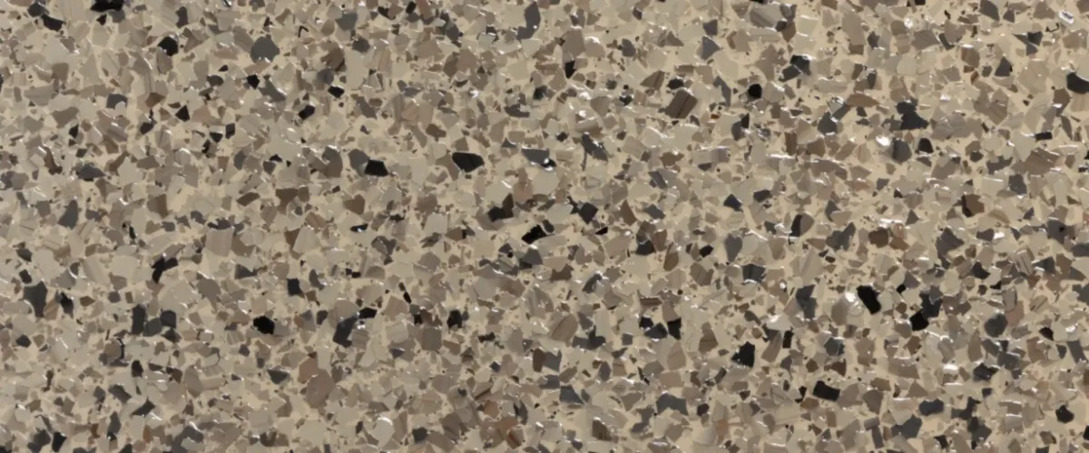 Close-up sample of tan, black, and brown epoxy flake color blend.