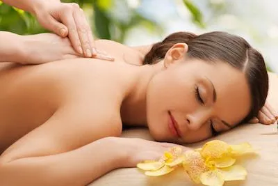Woman receivingmassage therapy to boost recovery and reduce soreness