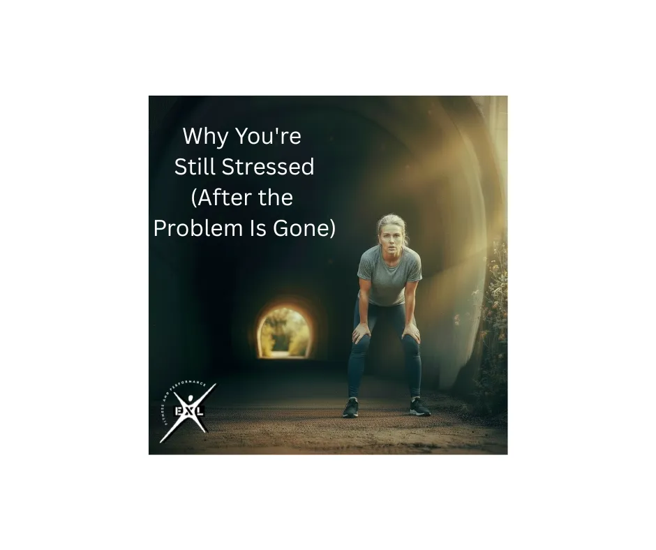 A woman in athletic wear pauses to catch her breath inside a dark tunnel, with golden light visible at the far end.
