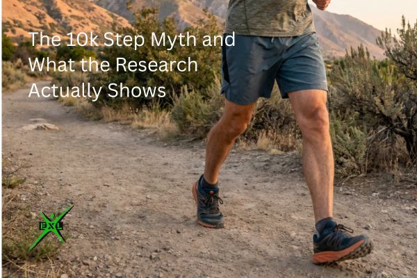 Man in his 60s walking briskly on a Utah mountain trail wearing a fitness tracker