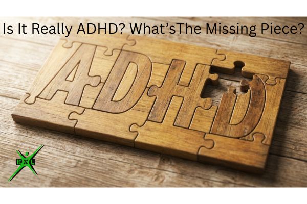 Wooden jigsaw puzzle spelling 'ADHD' with one piece missing from the letter D, on a wood table