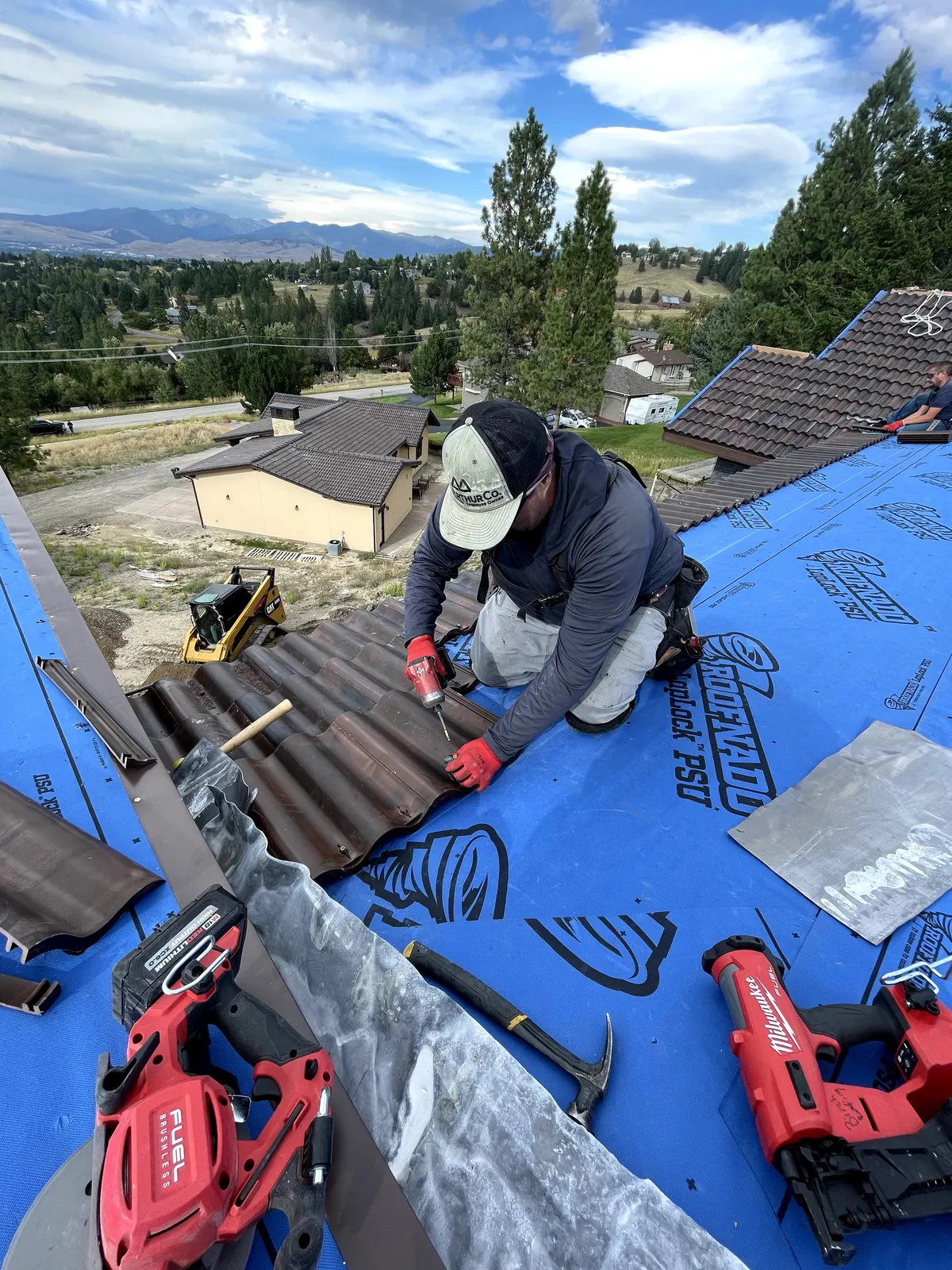 Anthony Birch, owner of Birch Roofing, installing a new roof on a home in Missoula, Montana