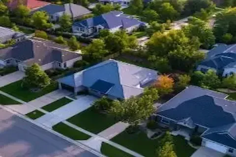 Aerial view of HOA planned community with residential roofing in Woodbury