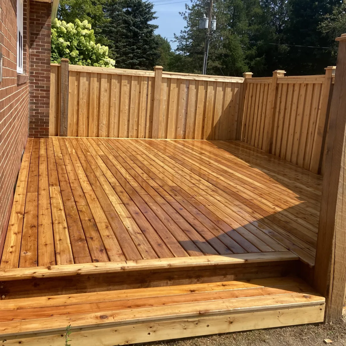Custom pressure-treated deck build in Fredericton backyard