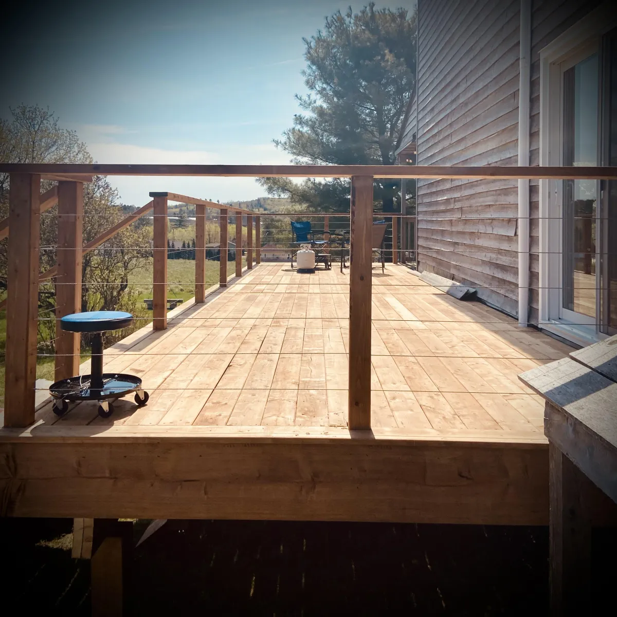 Custom pressure-treated deck build in Fredericton backyard