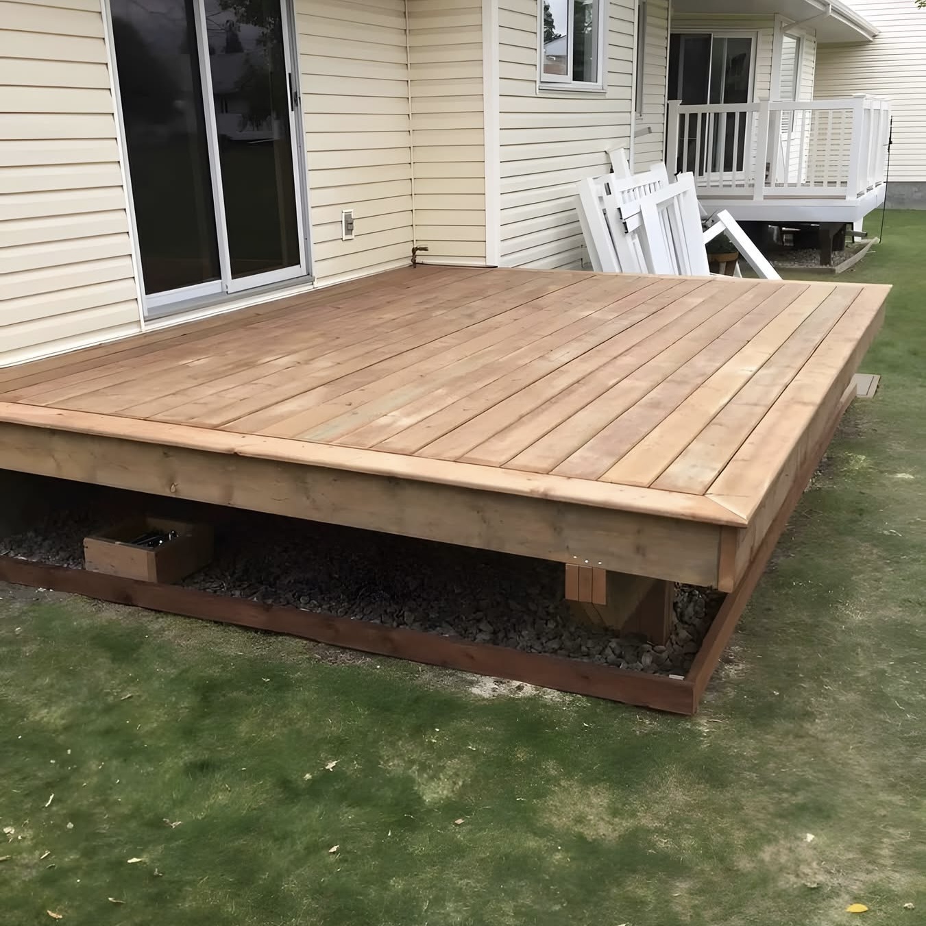 Custom pressure-treated deck build in Fredericton backyard