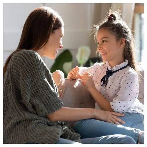 mother-daughter-sitting-smiling