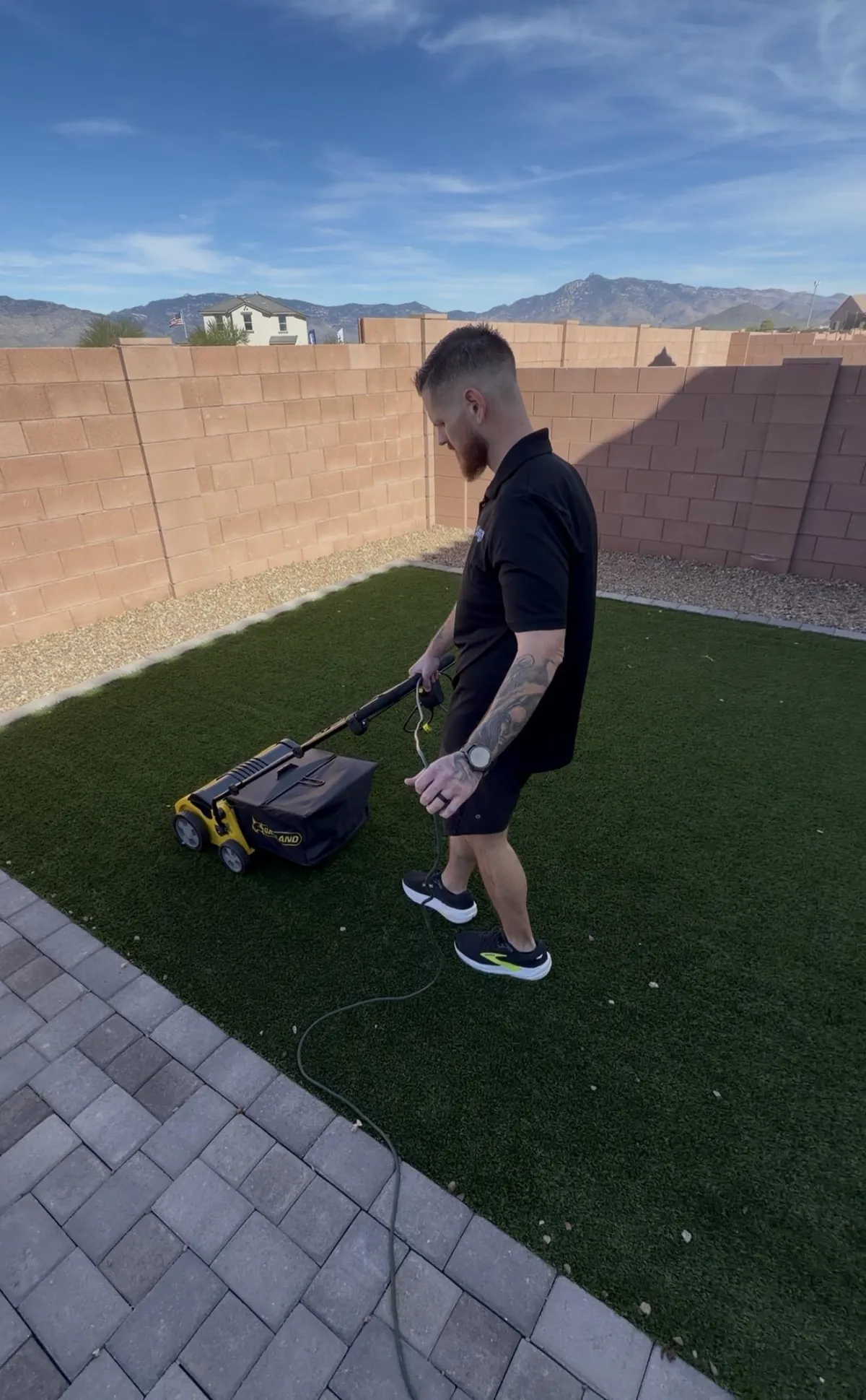 Commercial turf cleaning equipment brushing and decompacting artificial grass in Tucson