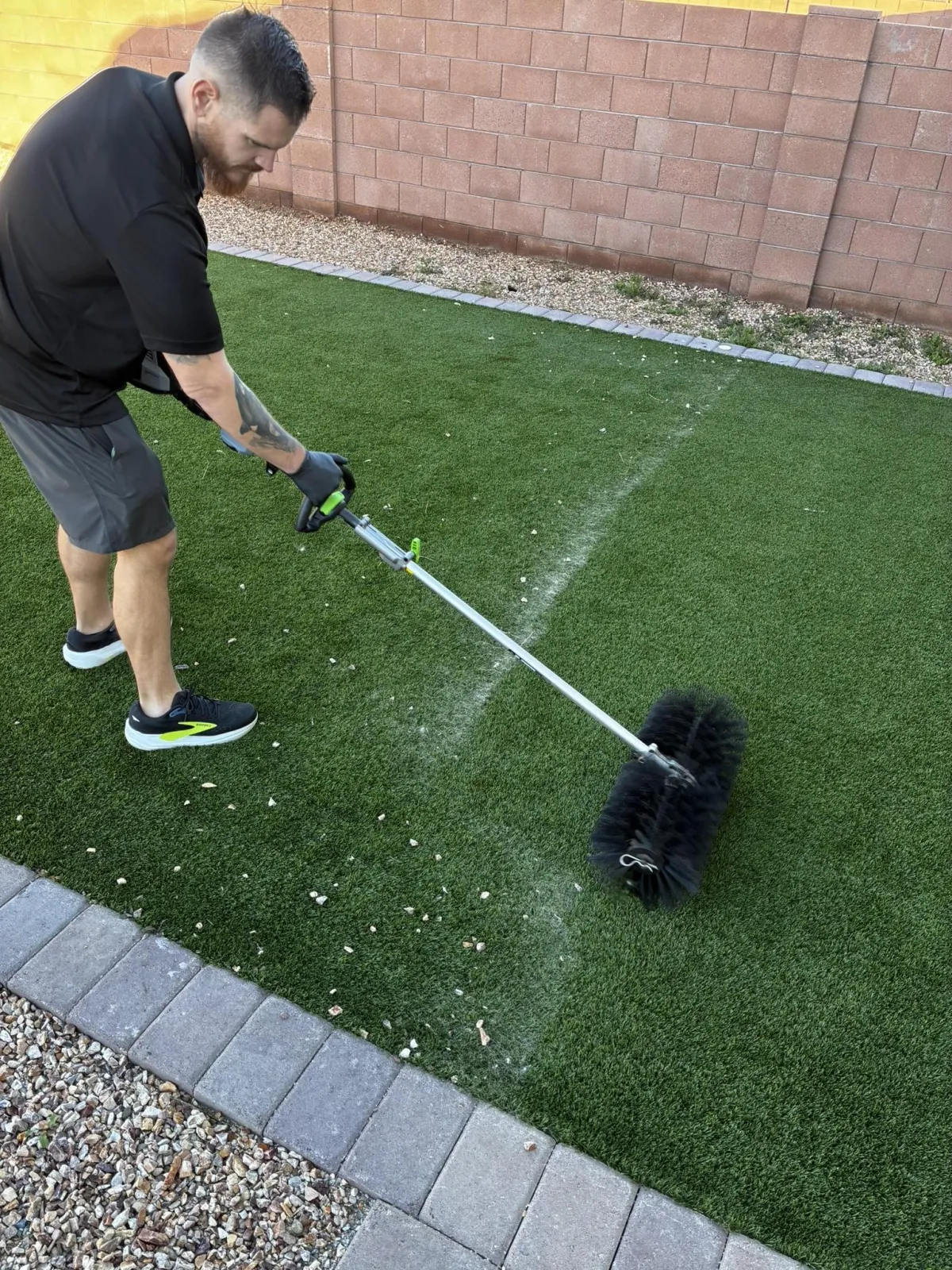 Deep turf agitation with rotary brush to loosen debris and refresh artificial grass in Tucson