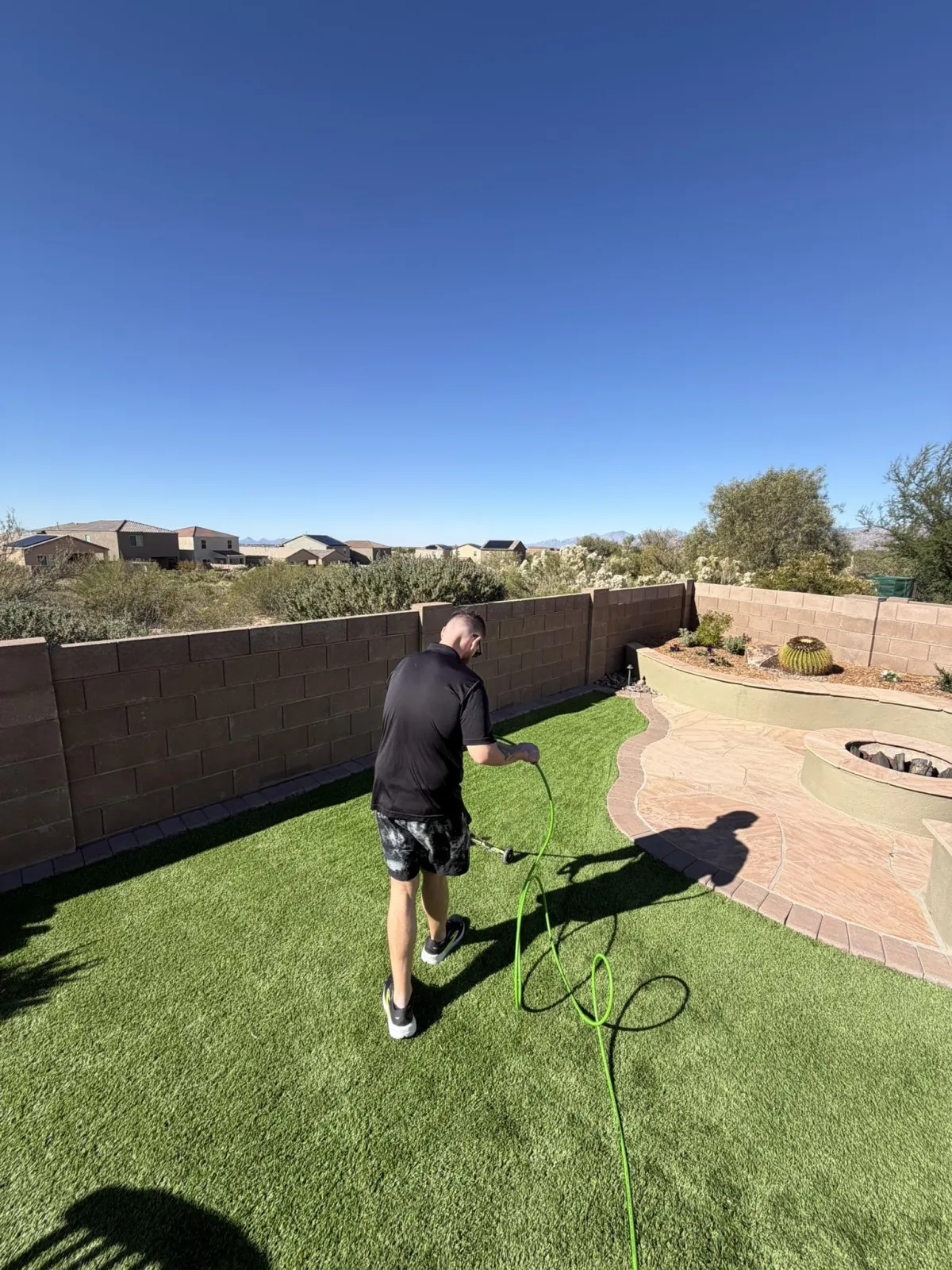 Deep artificial grass cleaning and maintenance service for pet-friendly Tucson homes