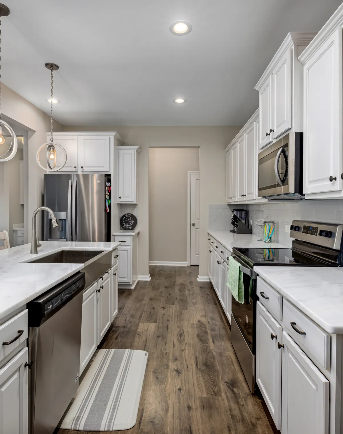 Close up of handyman fixing sink plumbing with wrench providing expert leak repair and maintenance services for homeowners in North Carolina