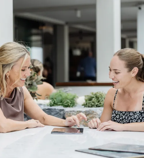 Women discussing life insurance protection options during an initial consultation.