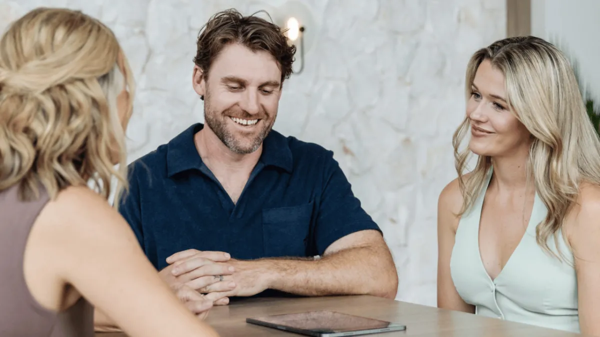 Clients meeting with an advisor to understand a simplified and supportive life insurance process.