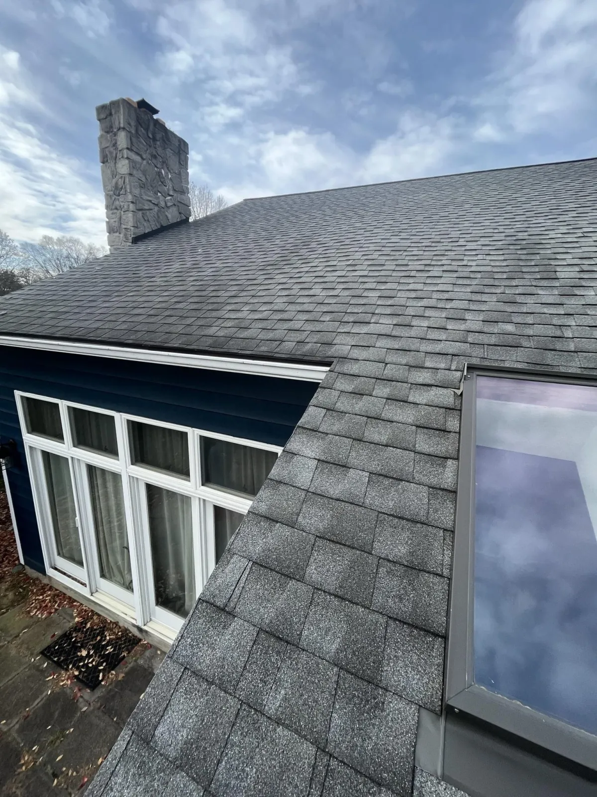 a newly installed shingle roofing