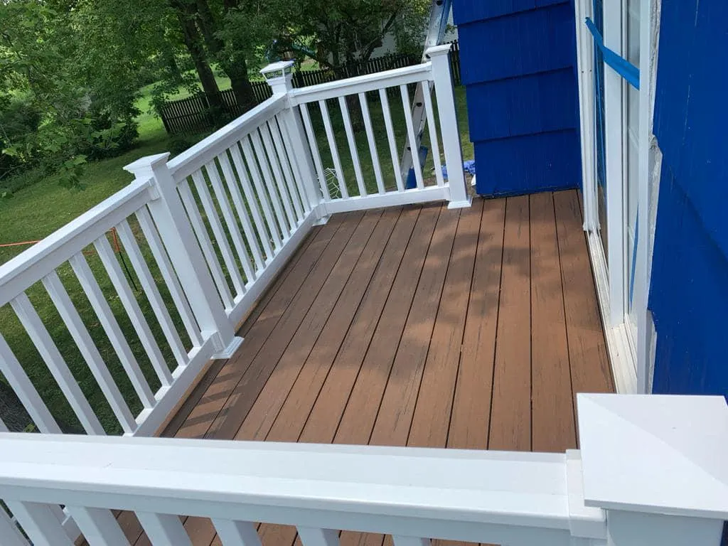 a deck with white fence